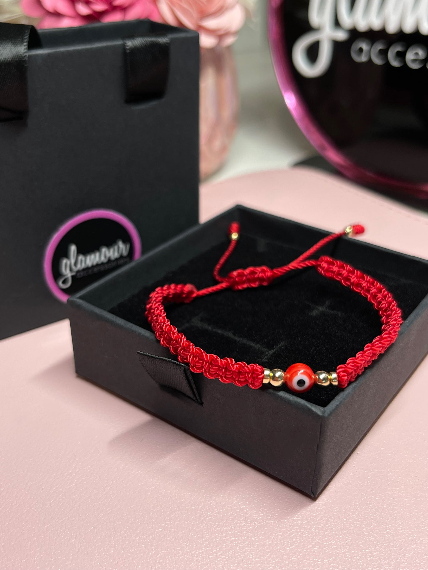 Red braided ojito bracelet